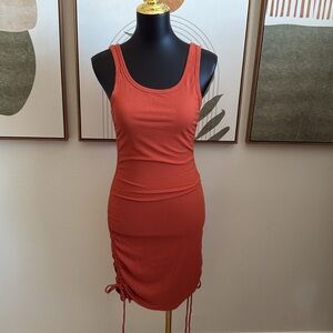 37. Yuoiouyu Orange Sleeveless Midi Ruched Side Tie Dress